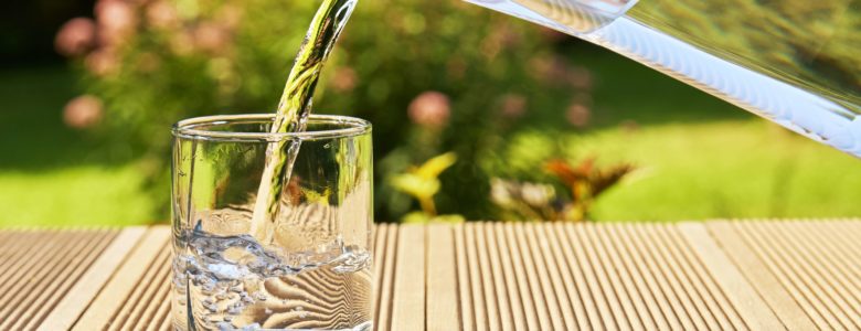 Pouring water into a glass - benefits of soft water