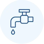 A simple blue outline of a water faucet with a single drop of water falling from its spout, centered on a light blue circular background.